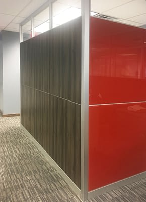 Image of solid red, wood grain and clear glass architectural walls.
