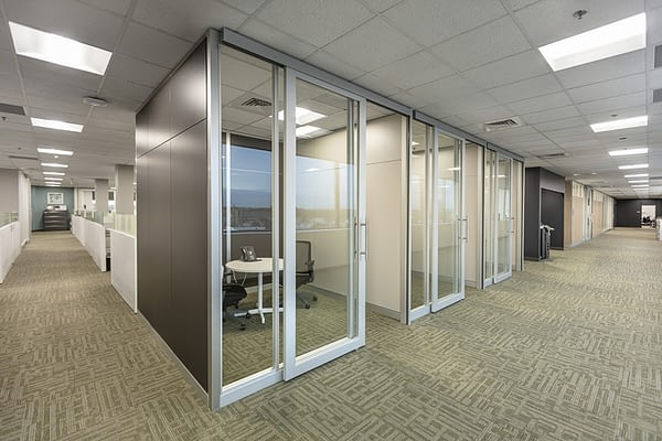 Image of solid and glass architectural walls with a glass door